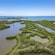 A mangrove estuary with the ocean in the distance